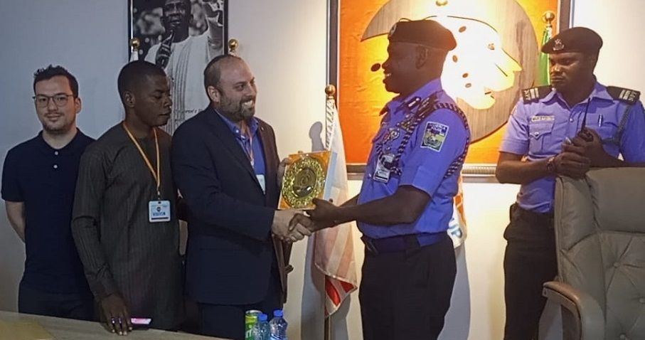Blockchain Legal's CEO and Co-Founder Receiving a Plaque of Honor from the Nigeria Police